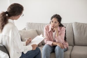 Woman talking to a professional addiction relapse specialist