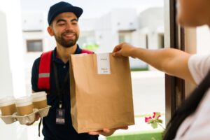 Male recovering from addiction working as a gig worker delivery person