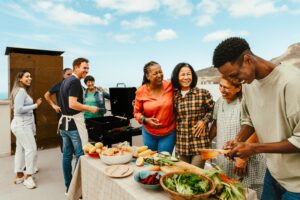 A group of people in addiction recovery enjoying a summer barbecue